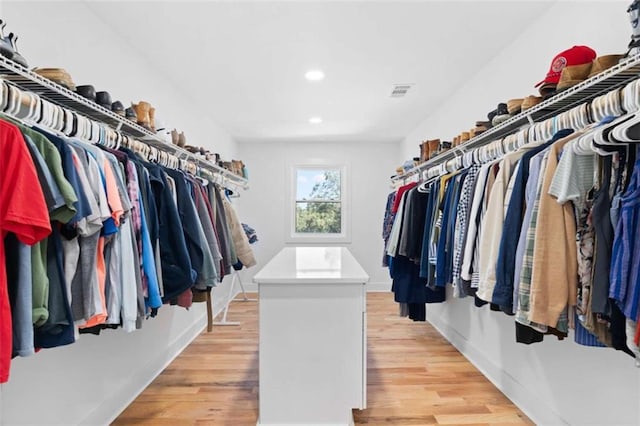 walk in closet featuring light wood-style floors and visible vents