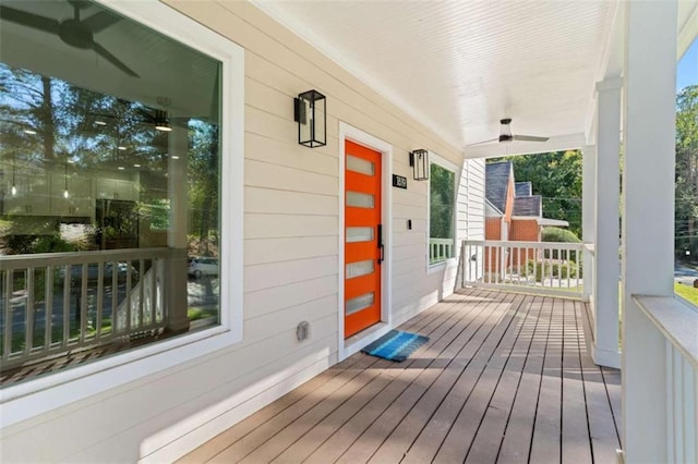 wooden deck featuring a ceiling fan