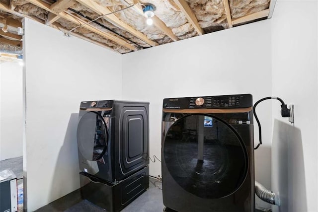 laundry area featuring laundry area and washing machine and clothes dryer