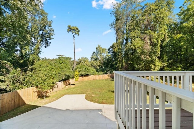 exterior space featuring a patio area, a fenced backyard, and a yard