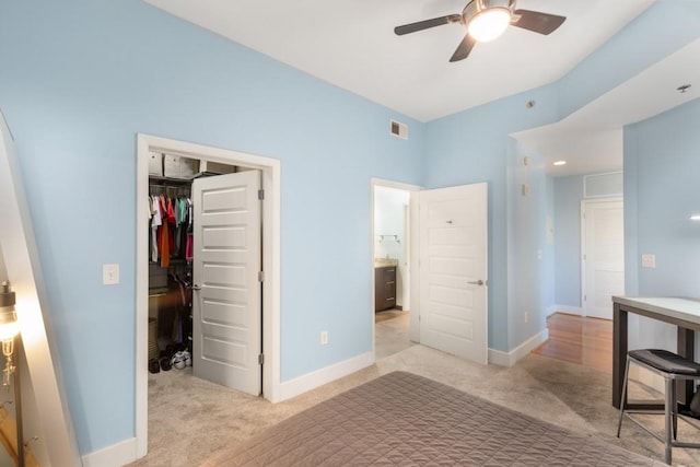 1080 Peachtree St NE Unit 608, Atlanta, GA 30309 - carpeted bedroom featuring a spacious closet, a closet, baseboards, and ceiling fan