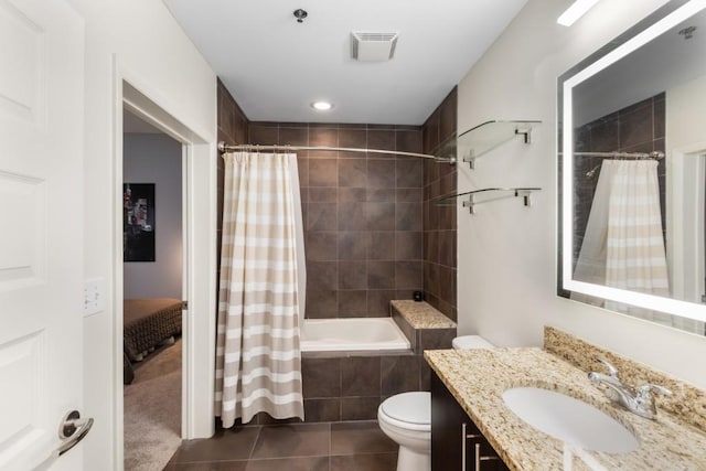 1080 Peachtree St NE Unit 608, Atlanta, GA 30309 - bathroom with tile patterned flooring, vanity, toilet, and tiled shower / bath combo