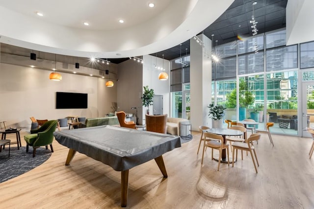 1080 Peachtree St NE Unit 608, Atlanta, GA 30309 - recreation room with a high ceiling, wood finished floors, billiards, recessed lighting, and floor to ceiling windows