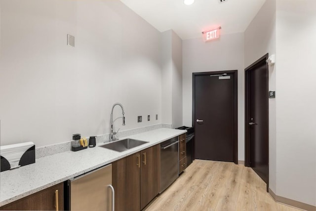 1080 Peachtree St NE Unit 608, Atlanta, GA 30309 - kitchen with a sink, stainless steel dishwasher, fridge, light wood-type flooring, and modern cabinets
