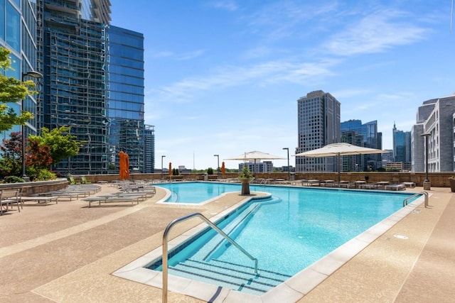 1080 Peachtree St NE Unit 608, Atlanta, GA 30309 - community pool featuring a patio and a city view