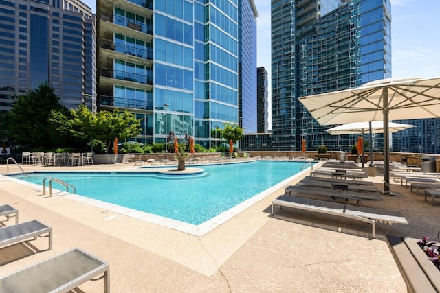 1080 Peachtree St NE Unit 608, Atlanta, GA 30309 - community pool with a patio area