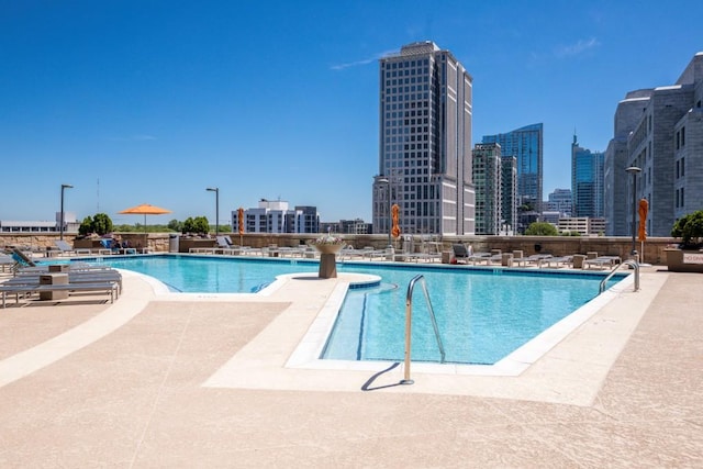 1080 Peachtree St NE Unit 608, Atlanta, GA 30309 - community pool featuring a patio area and a skyline view