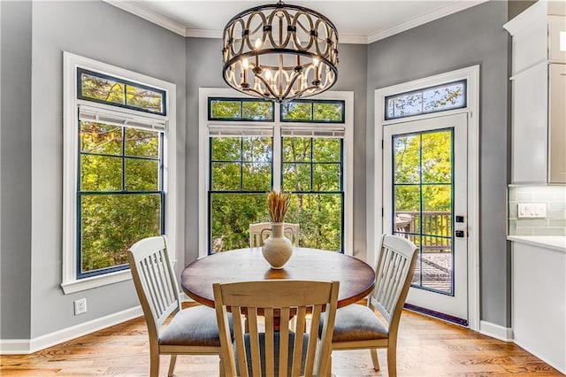 51 River Overlook Ct, Dawsonville, GA 30534 - dining area with plenty of natural light, a chandelier, light wood-style floors, and crown molding