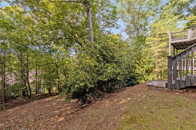 51 River Overlook Ct, Dawsonville, GA 30534 - view of yard with stairs and a wooden deck