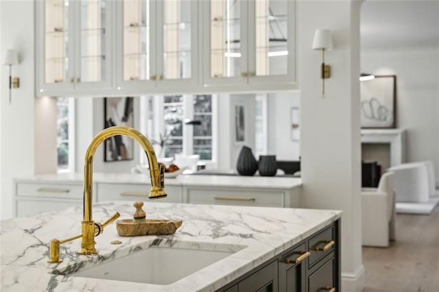 room details with light stone counters and sink