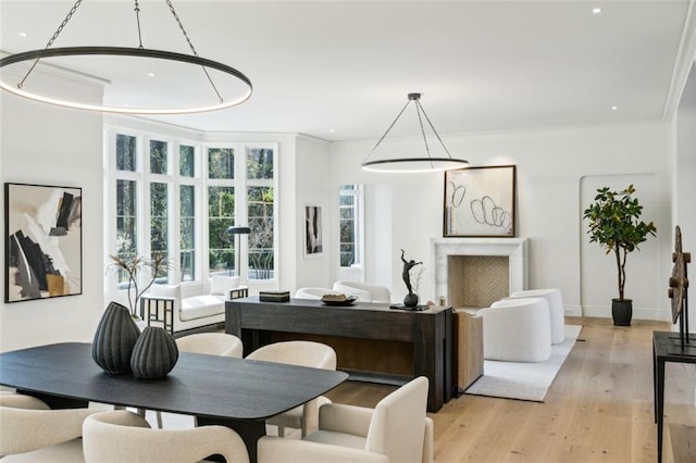 interior space with light hardwood / wood-style flooring and crown molding