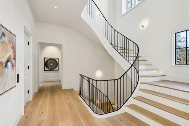 staircase with wood-type flooring