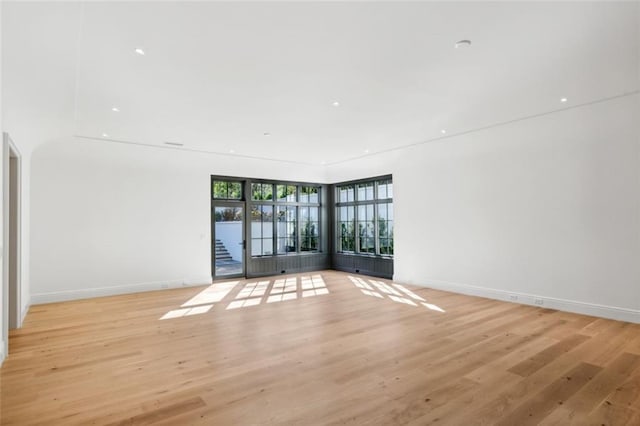 unfurnished room with light hardwood / wood-style flooring