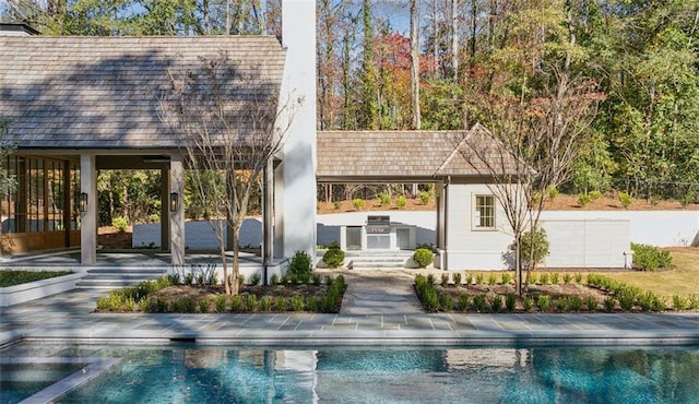 view of swimming pool featuring a patio area