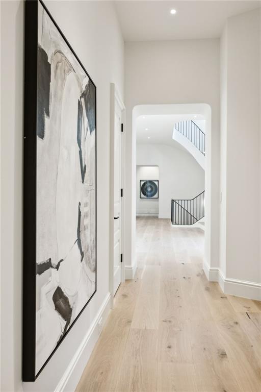 corridor featuring light hardwood / wood-style floors and washer / clothes dryer