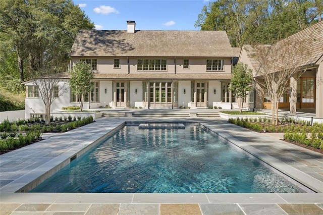 back of house featuring a patio and french doors