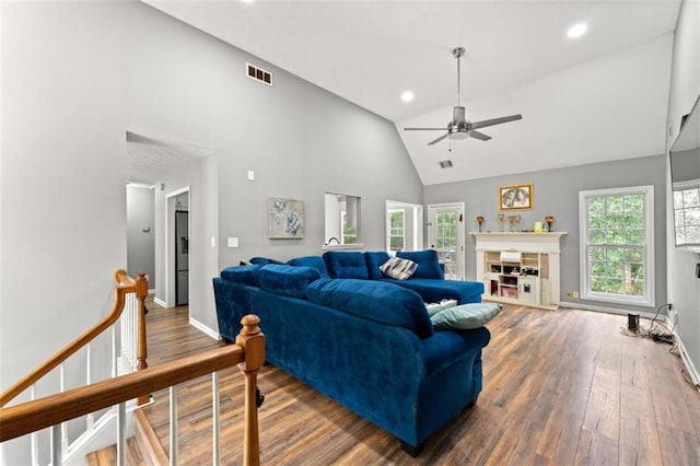 living room featuring hardwood / wood-style floors, plenty of natural light, high vaulted ceiling, and ceiling fan