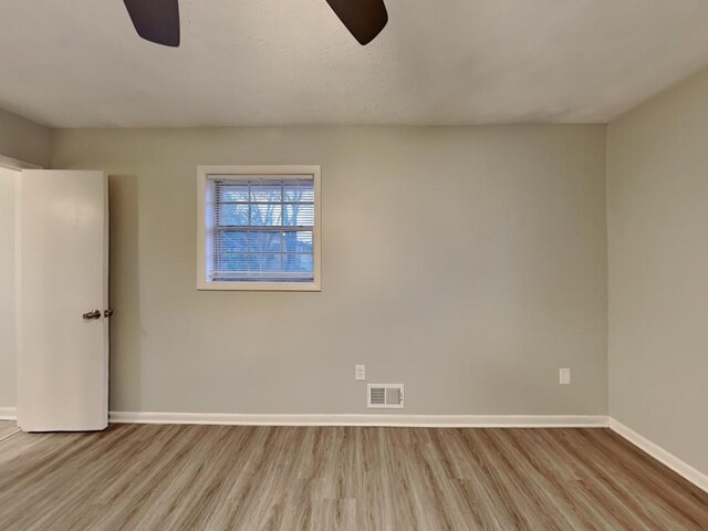 unfurnished bedroom featuring ceiling fan, a closet, light hardwood / wood-style flooring, and a textured ceiling