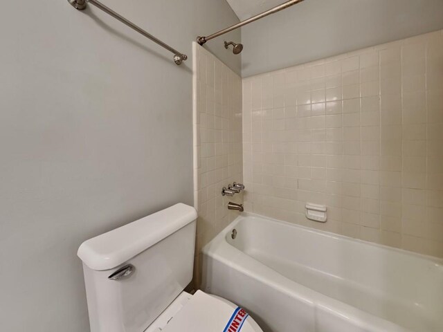 bathroom with vanity, toilet, and a shower