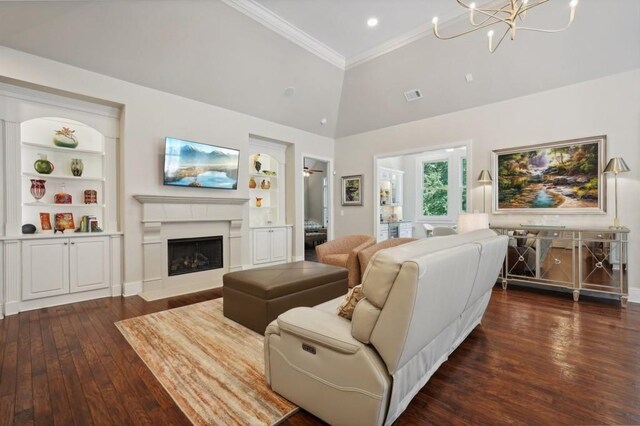 living room with crown molding, high vaulted ceiling, built in features, and dark hardwood / wood-style flooring