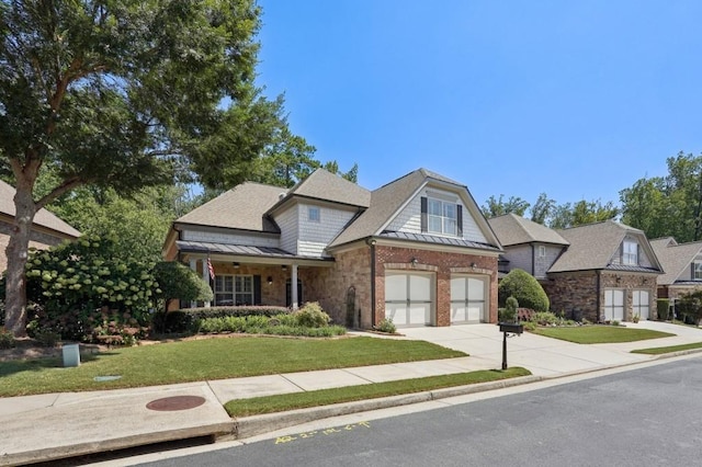 view of front of home featuring a front lawn and a garage