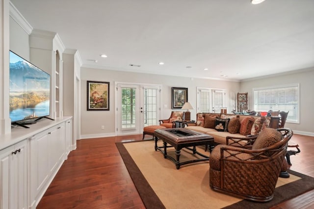 living room with ornamental molding and dark wood-type flooring