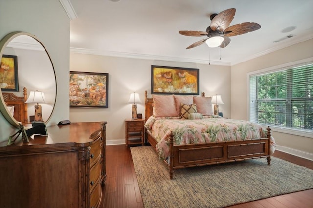 bedroom with dark wood-type flooring, crown molding, and ceiling fan