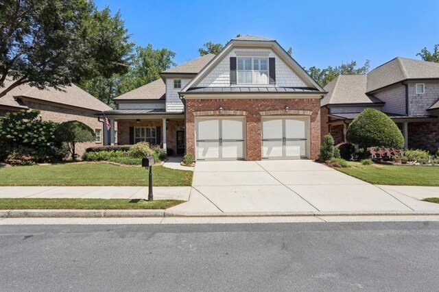 view of front facade with a garage and a front lawn