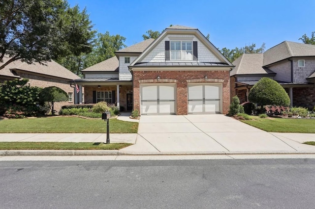 view of front of property with a garage and a front yard