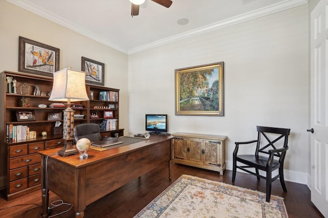 home office with crown molding, dark wood-type flooring, and ceiling fan