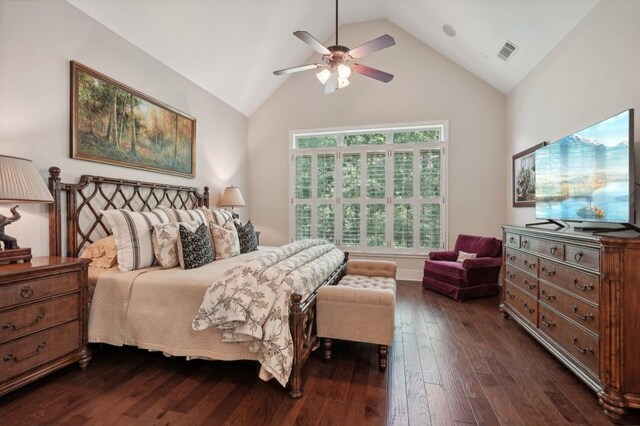 bedroom featuring dark wood-type flooring, ceiling fan, and high vaulted ceiling