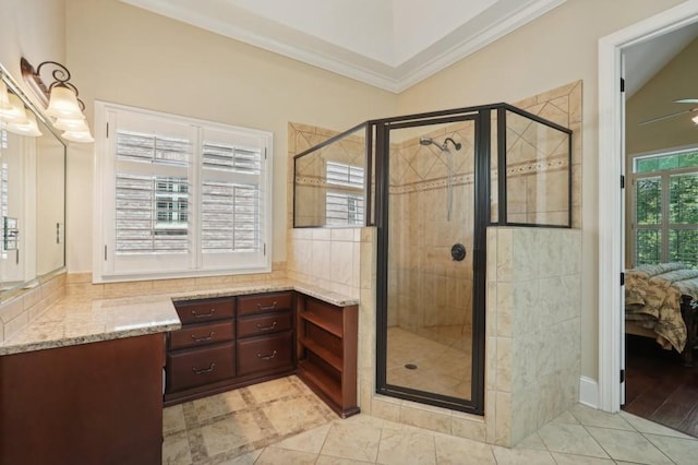 bathroom with vanity, crown molding, and a shower with shower door