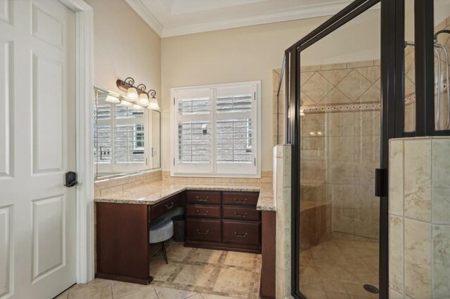 bathroom featuring vanity, ornamental molding, and a shower with shower door