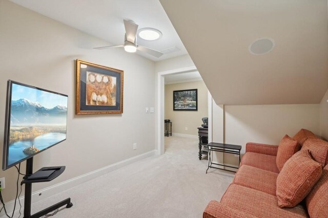 interior space featuring light carpet and ceiling fan