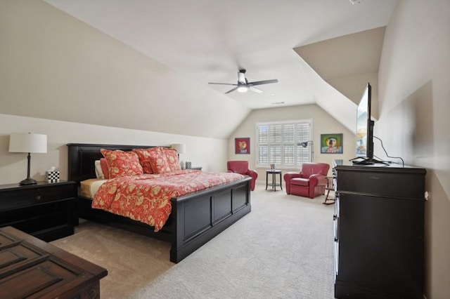 carpeted bedroom featuring lofted ceiling and ceiling fan