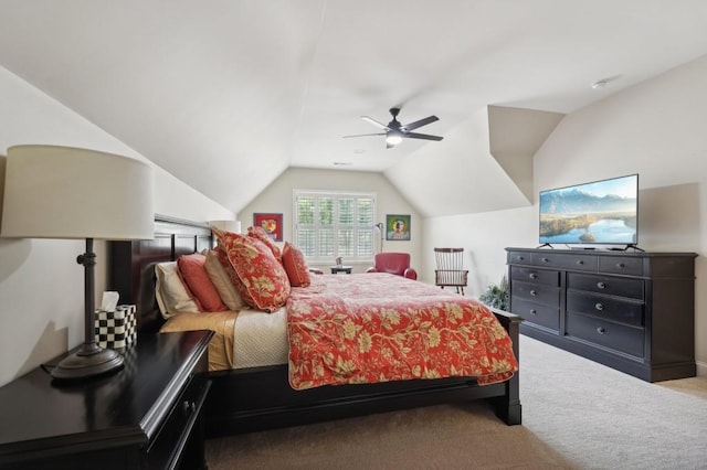 bedroom with lofted ceiling, light colored carpet, and ceiling fan