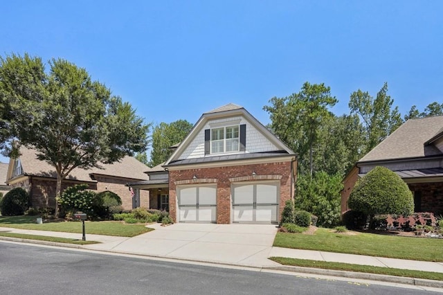 view of front of house featuring a front yard and a garage