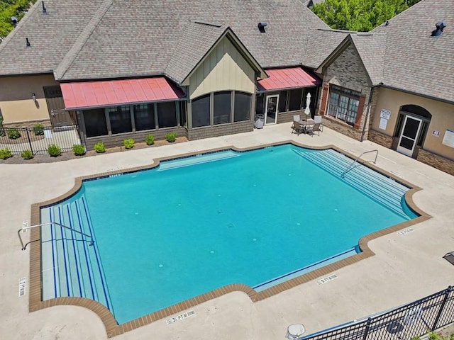 view of swimming pool featuring a patio