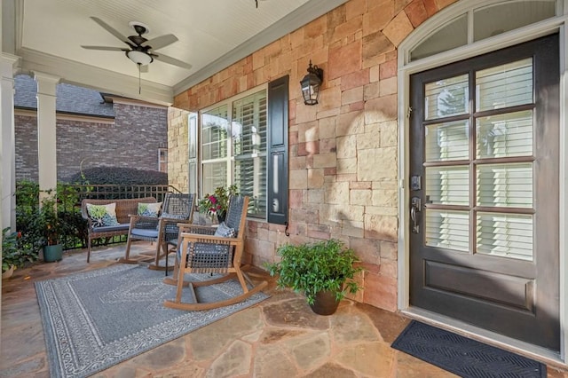 doorway to property with covered porch and ceiling fan