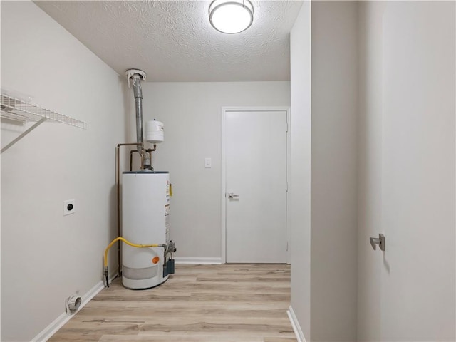 utility room with water heater