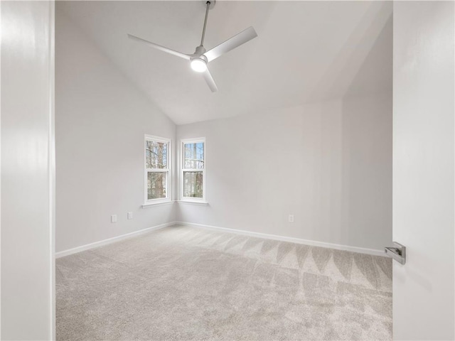 carpeted spare room with lofted ceiling and ceiling fan