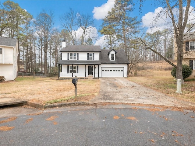 view of front of house featuring a garage and a front yard