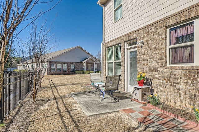 view of patio featuring fence