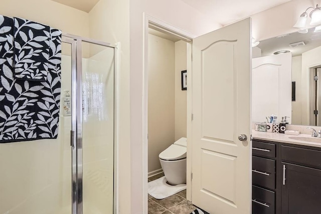 full bath featuring vanity, visible vents, a stall shower, tile patterned flooring, and toilet