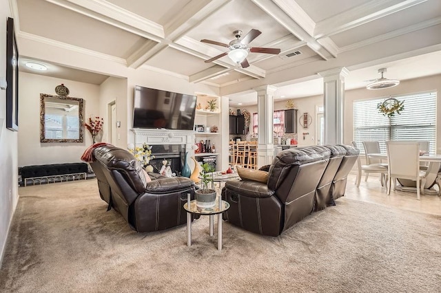 living area featuring decorative columns, coffered ceiling, a fireplace, and carpet flooring