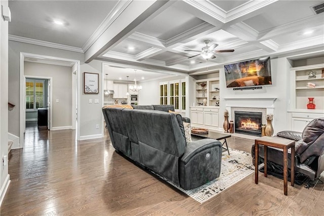 4831 Miller Hill Rd, Buford, GA 30518 - living area with ornamental molding, wood finished floors, a fireplace with flush hearth, a ceiling fan, and baseboards