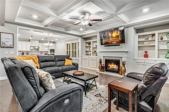 4831 Miller Hill Rd, Buford, GA 30518 - living room featuring wood finished floors, crown molding, a warm lit fireplace, a ceiling fan, and recessed lighting