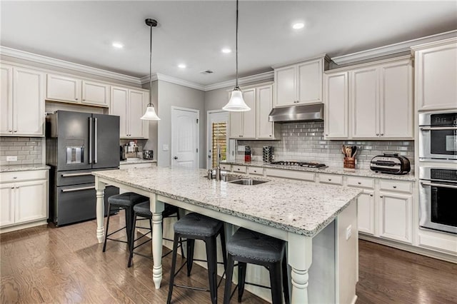 4831 Miller Hill Rd, Buford, GA 30518 - kitchen with appliances with stainless steel finishes, a sink, backsplash, ornamental molding, and dark wood-type flooring