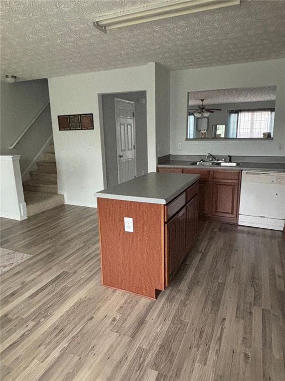 6231 Redan Overlook, Lithonia, GA 30058 - kitchen featuring white dishwasher, dark wood-type flooring, and a sink