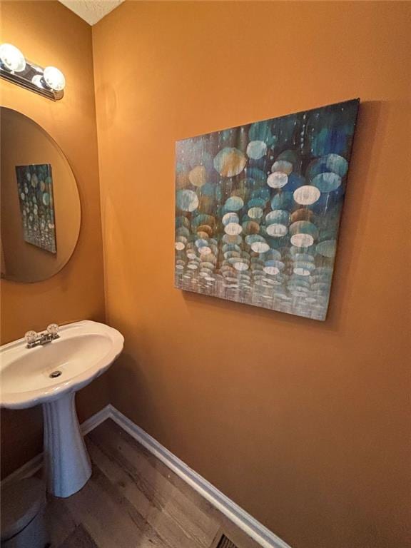 6231 Redan Overlook, Lithonia, GA 30058 - bathroom featuring wood finished floors and baseboards